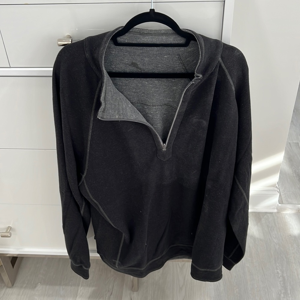 A reversible, black and gray quarter zip Tommy Bahama pull over pull over